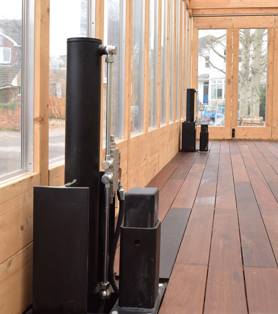 Once a flood warning is issued, the owners pack the building with their furniture and other possessions that risk damage and raise the greenhouse via remote control