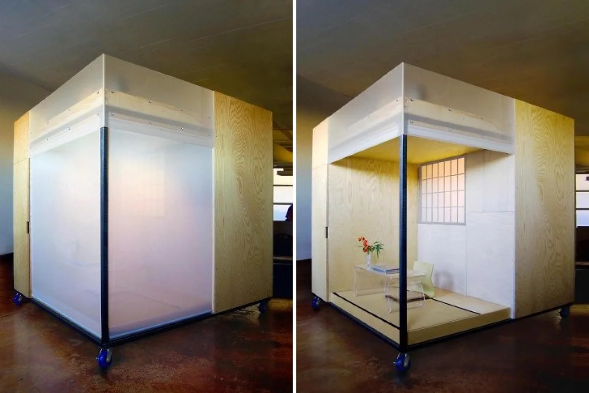 The versatile cube loft features a steel frame, plywood furnishings and houses an office, bed, storage and meditation space