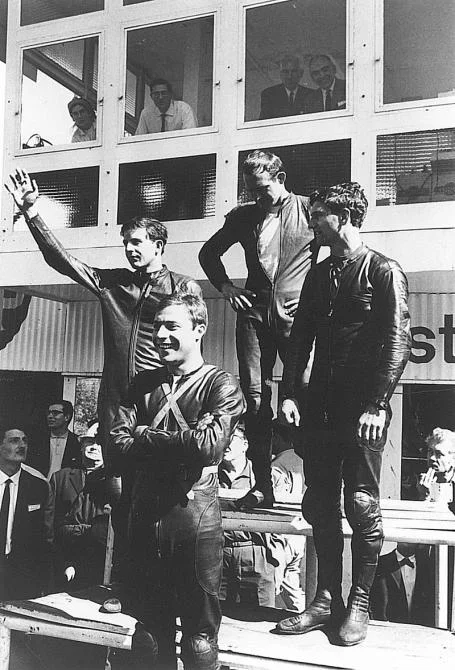 Mike Hailwood and another of the all-time greats, Phil read on the podium circa 1965. Compare the fashion of 40 years ago with the colourful livery of today