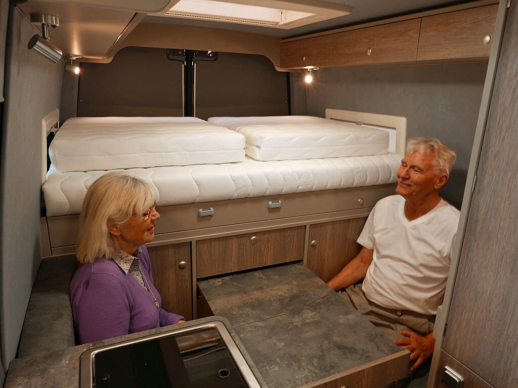 The simple dining area seats two at a pull-out table