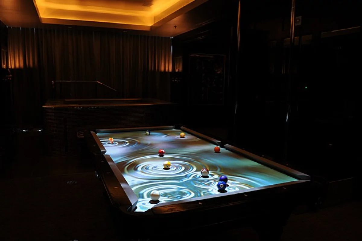 The CueLight Interactive Pool Table System projects an animated display on pool tables, that follows the balls as they move
