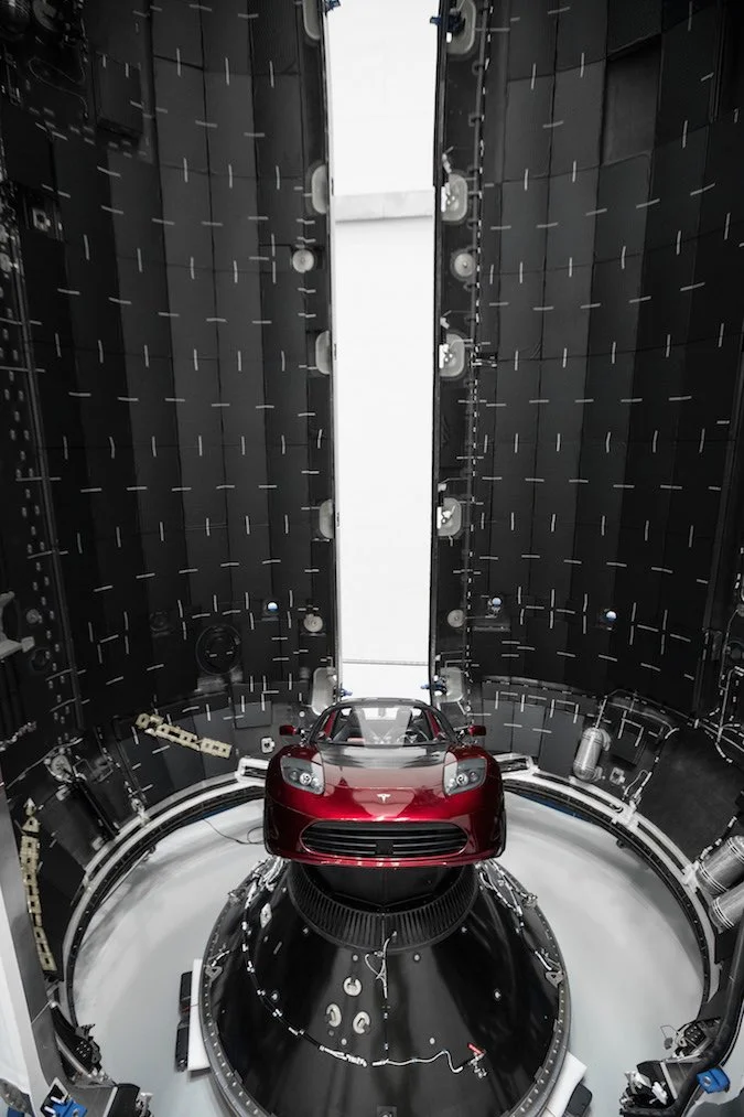 Inside the nosecone of SpaceX's Falcon 9 rocket, with a Tesla roadster ready to be fired into space