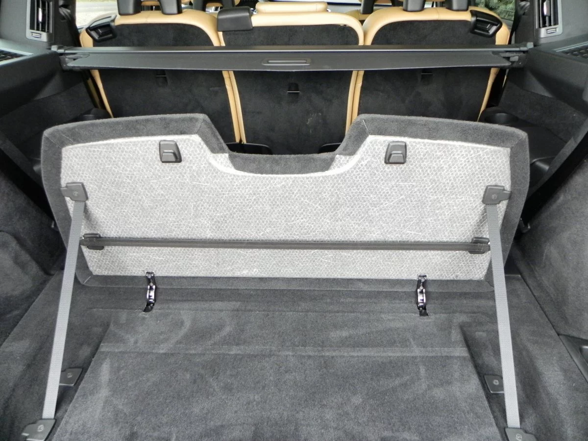 Built-in cargo organization gadgets like this integrated divider pop-up help keep things where they're intended to be on the drive home