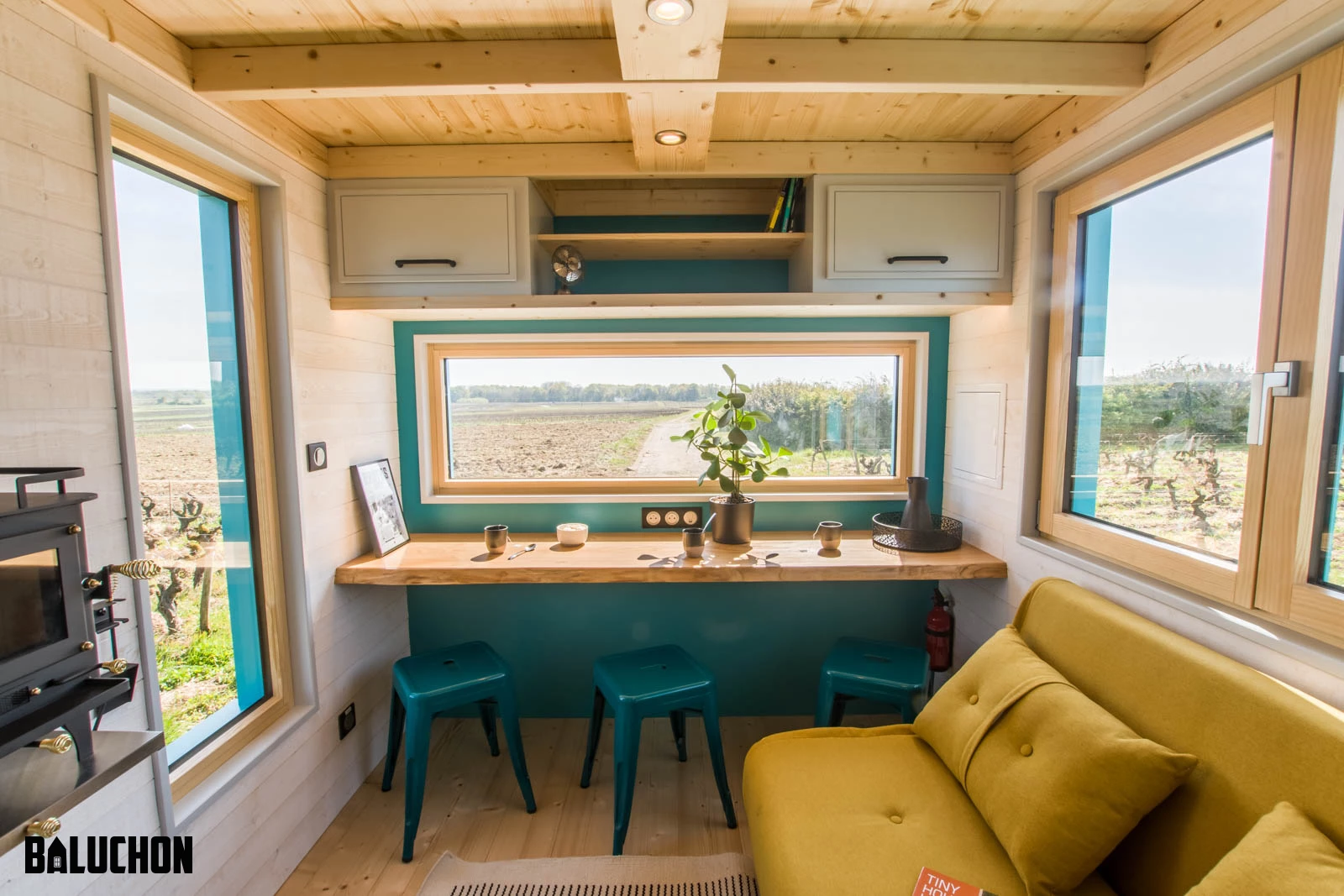 Tiny House Sïana's living room includes a dining area with stool seating