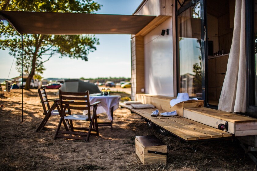 As anyone who's camped in a small van will tell you, a semi-outdoor living area makes life much easier