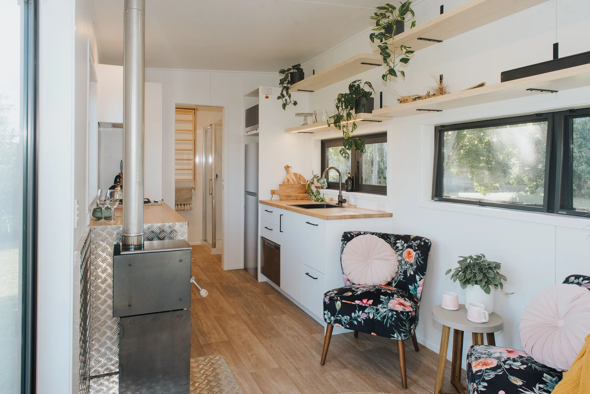 Visitors enter the Piwakawaka through double glass doors into a small living area