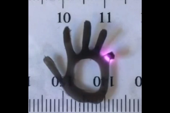 A finger on the hydrogel hand bends in response to near-infrared laser light