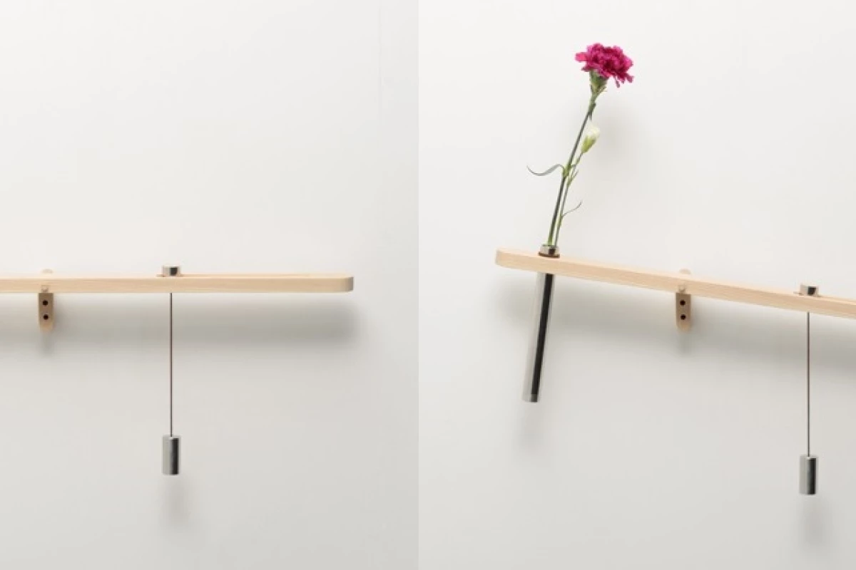 Water Balance offers a visual reminder to feed your houseplants, by visibly showing how much liquid has evaporated from a vase of flowers