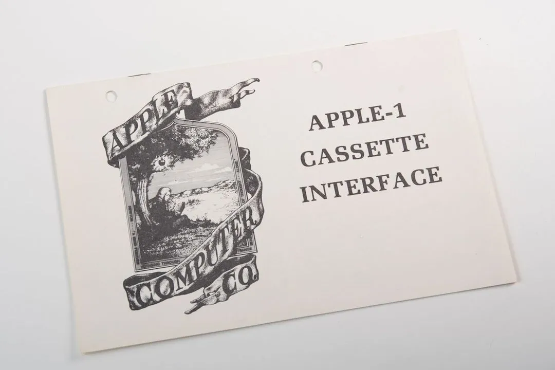 A tag showing the very first logo design for Apple