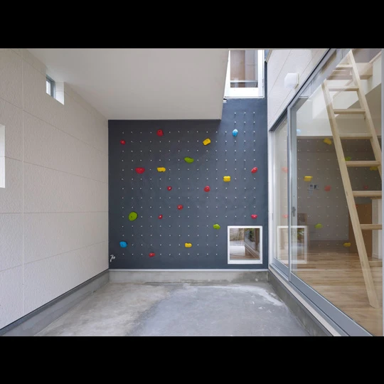 Located in a suburban area in Tokyo, 3way House is creative family home featuring a series of climbing walls and ladders