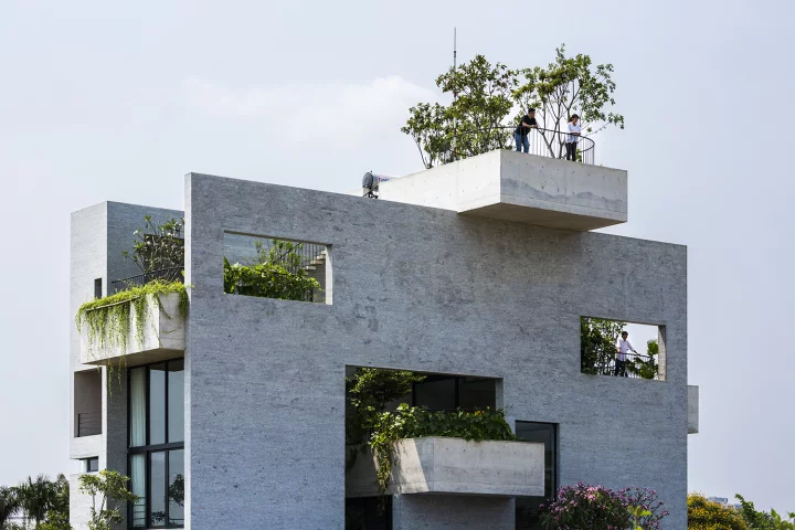 Binh House's greenery shades the home and its layout creates a stack effect, where air is drawn inside for improved ventilation