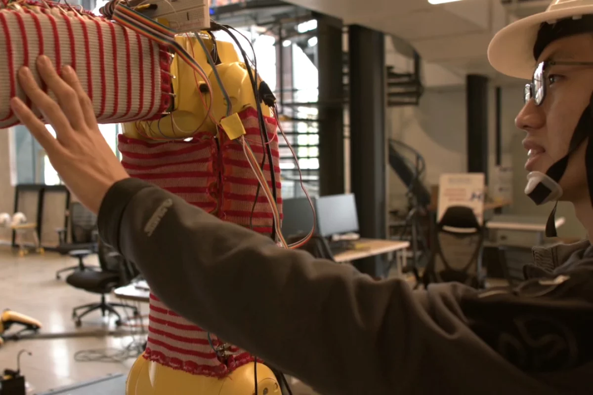 A RobotSweater-wearing robot could immediately cease movement upon accidentally making contact with an adjacent human worker