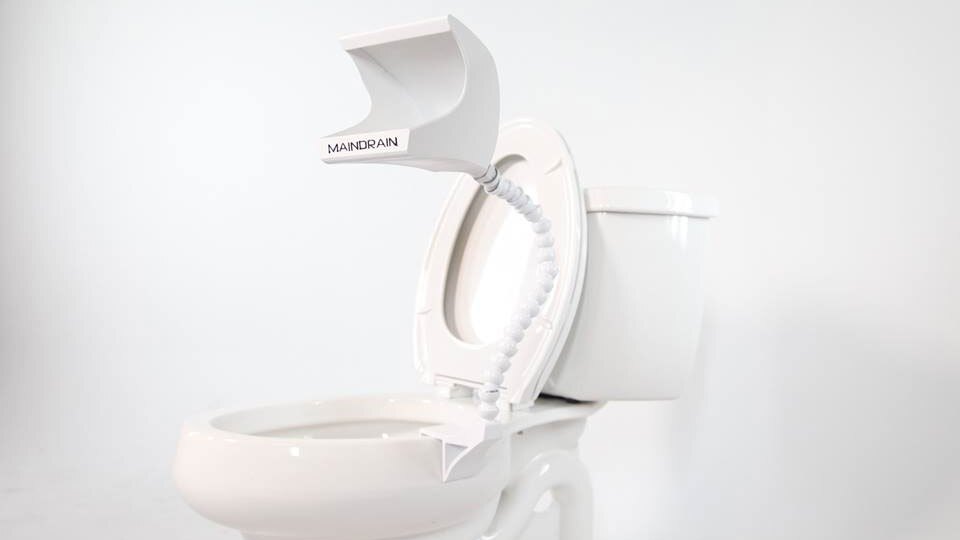 The Main Drain is designed to attach to the rim of an existing toilet