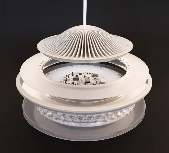 An expanded Fluxo lamp shows heat sink, circular array of LEDs (up-facing), and light diffusers