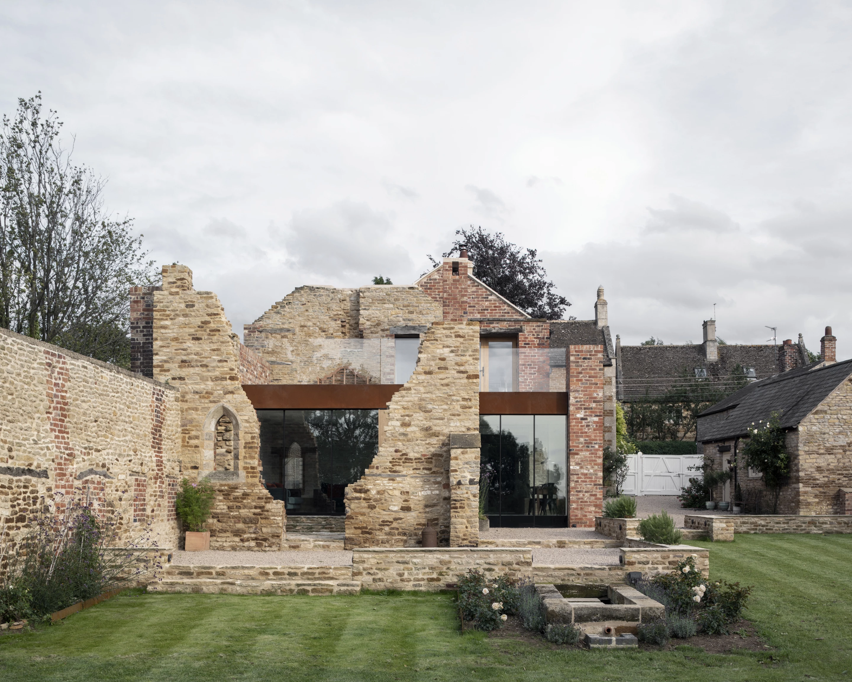 The Parchment Works was designed by Will Gamble Architects and is located in Suffolk. The house extension, which was one of 20 projects to feature in the 2022 RIBA House of the Year longlist, is built into the ruins of a historic parchment factory