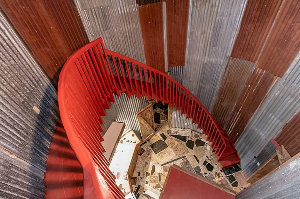 The Cowboy Boot House features an impressive-looking spiral staircase that leads to a rooftop deck