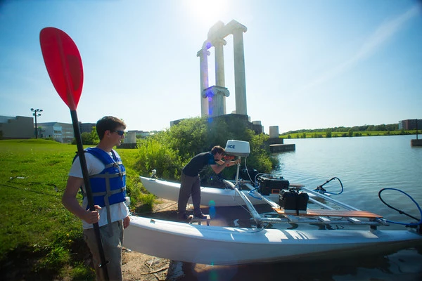 Two members of startup Buffalo Automation Group prepare to cast off with their preemptive autopilot system onboard
