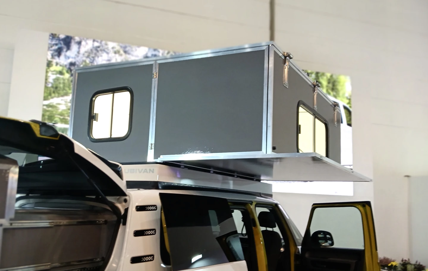 Cubivan's rooftop camper solution offers four hard walls, plenty of space and an oversized king mattress
