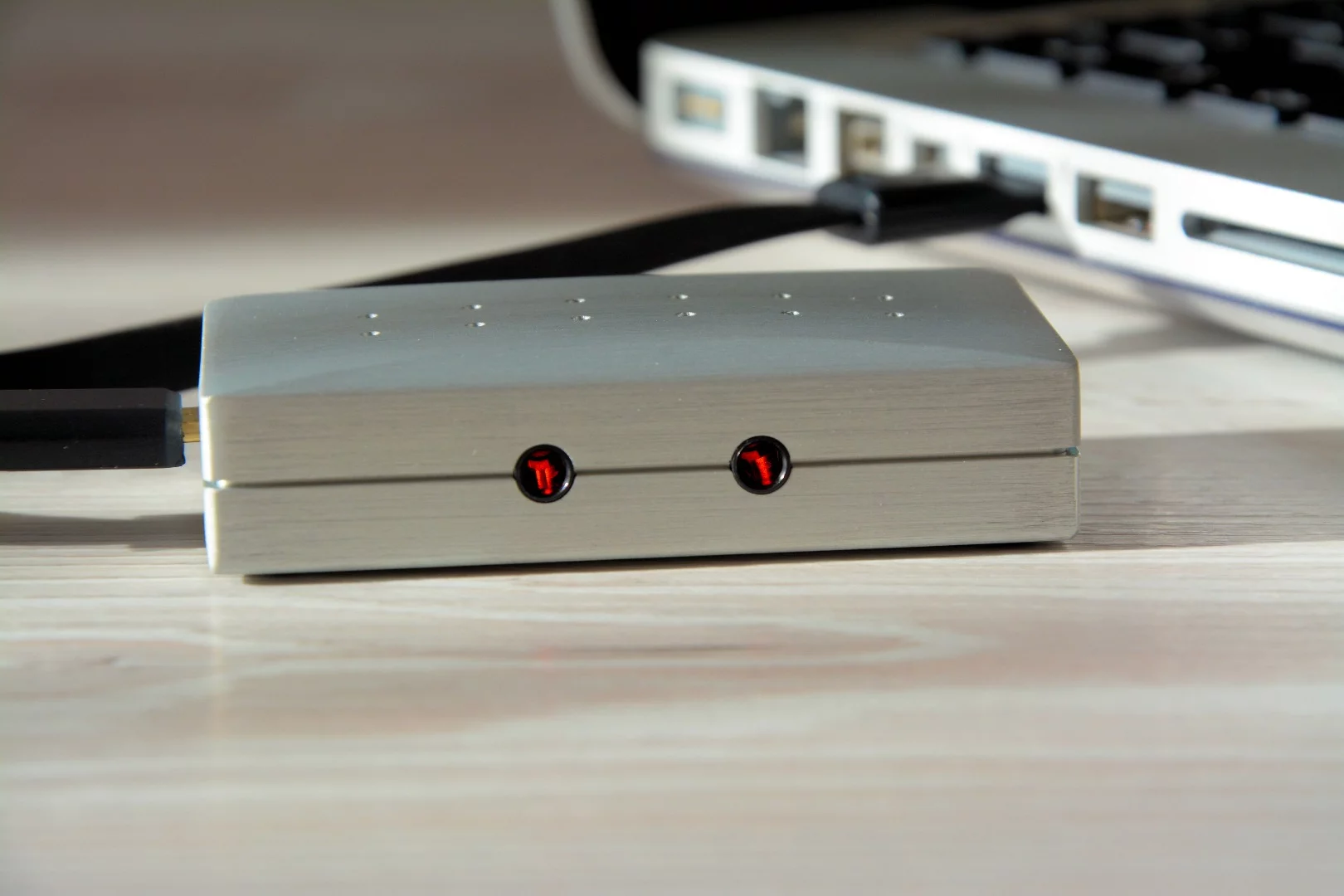 The 3.5 mm headphone out jacks double as optical outputs