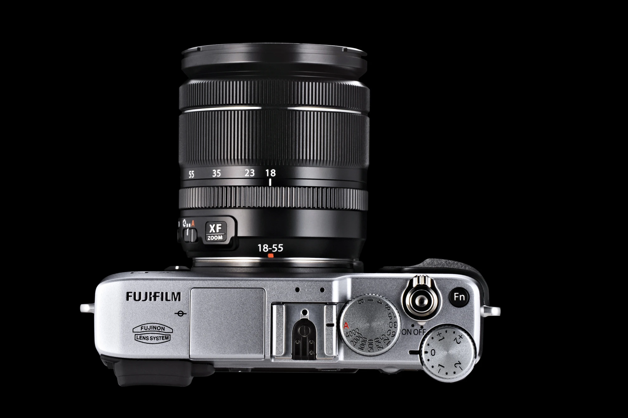 Manual control dials for shutter speed and exposure feature on the top panel of the Fujifilm X-E1 along with a Fn (Function) button