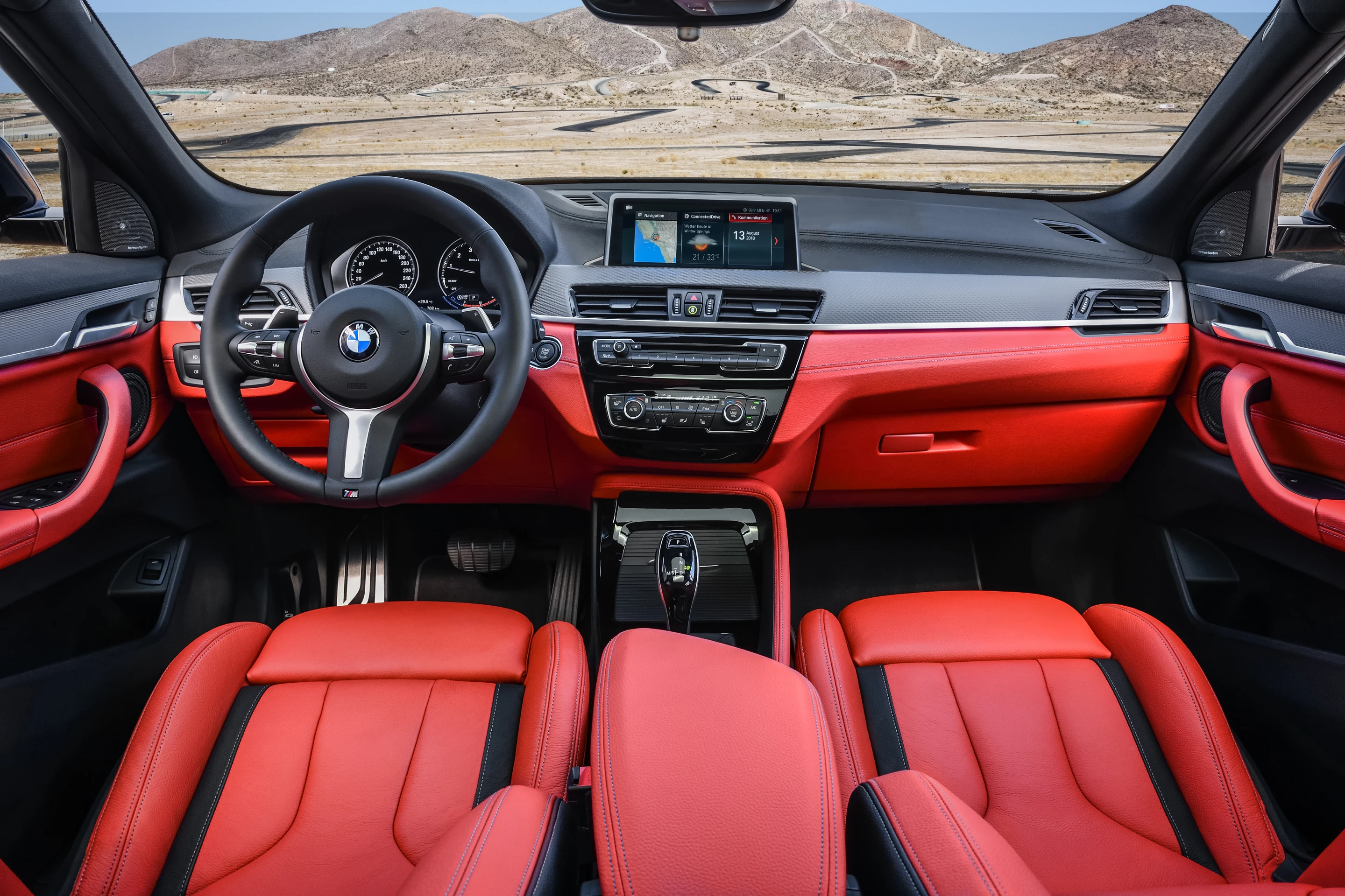 Inside the M35i's cabin there’s an M Sport leather steering wheel with shift paddles and BMW’s iDrive display alongside it