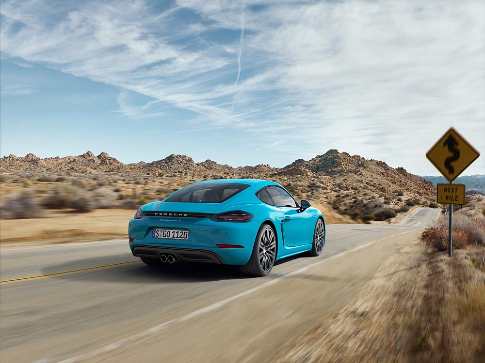 The raised spoiler and clear lensed taillights have transferred across from the Boxster