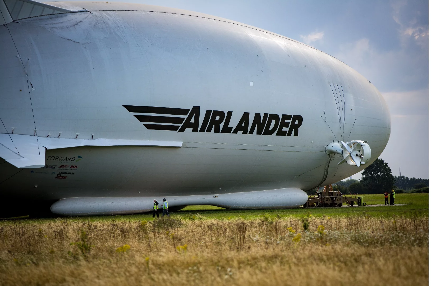 Workers attend to the Airlander 10 after its first public appearance in the UK