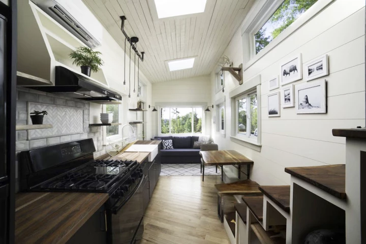 The interior of the Legacy tiny house is a treat of lovers of fine woodworking