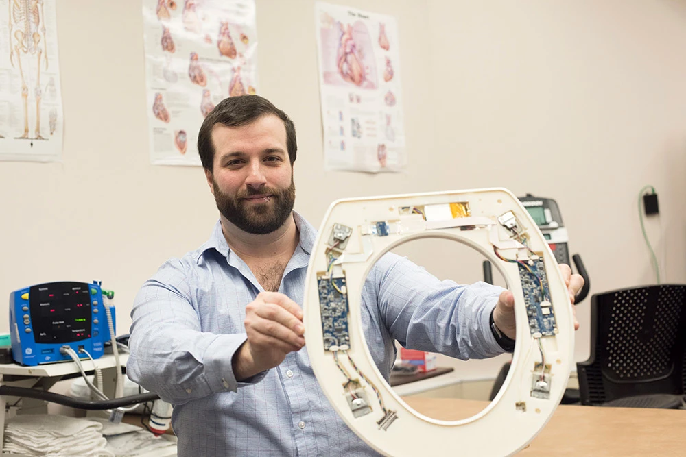 Nicholas Conn with one of the prototype toilet seats