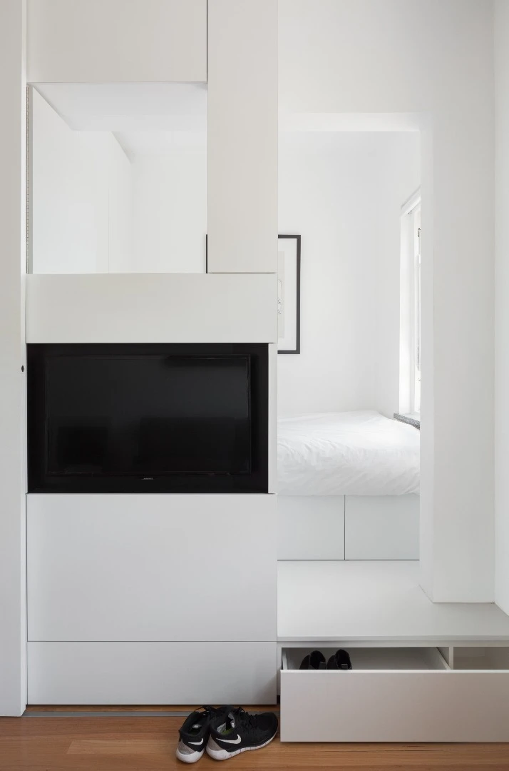 Adopting a minimalist approach, Swartz's design features pragmatic furnishings which fit together like Tetris pieces and seem to disappear into the surrounding white lines