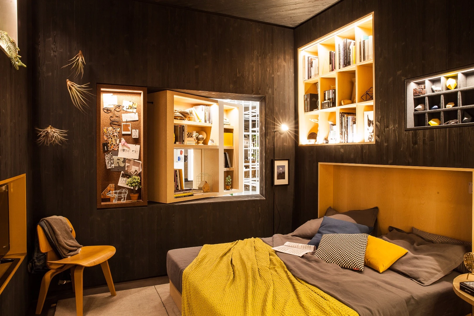 The apartment's walls are formed of fold-out shelving modules