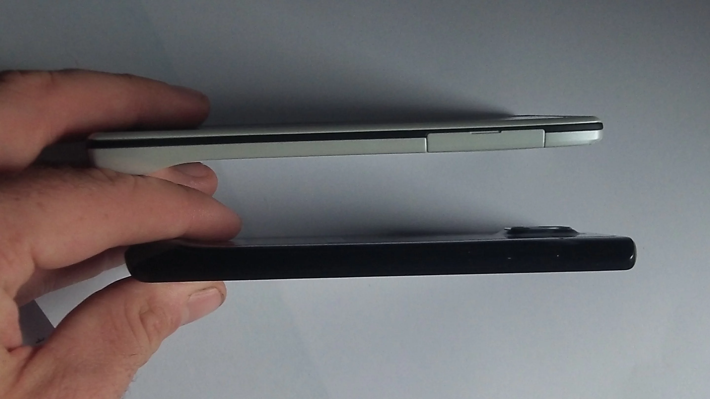 The profile of a Droid Razr (in white) and the Ascend P1