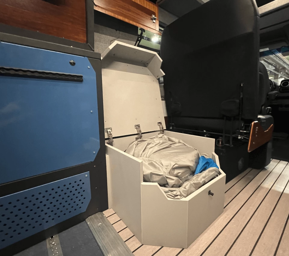 Shower curtain folded up inside the floor pan box