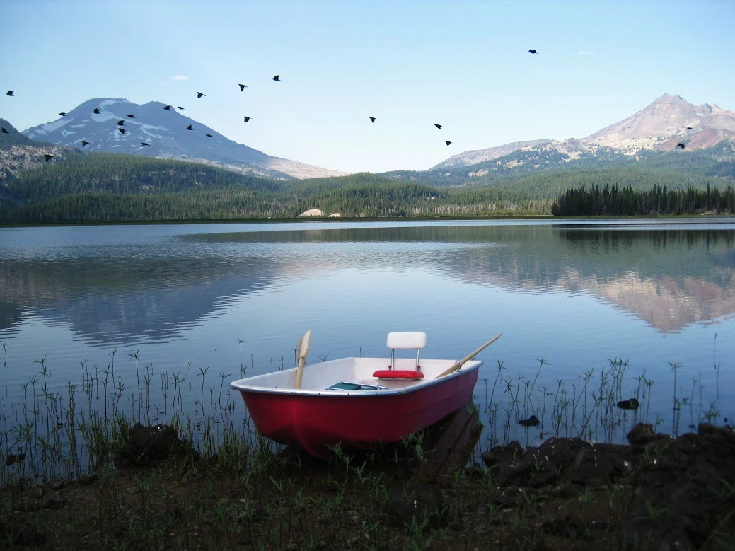 The boat lets up to three people row or motor around the lake
