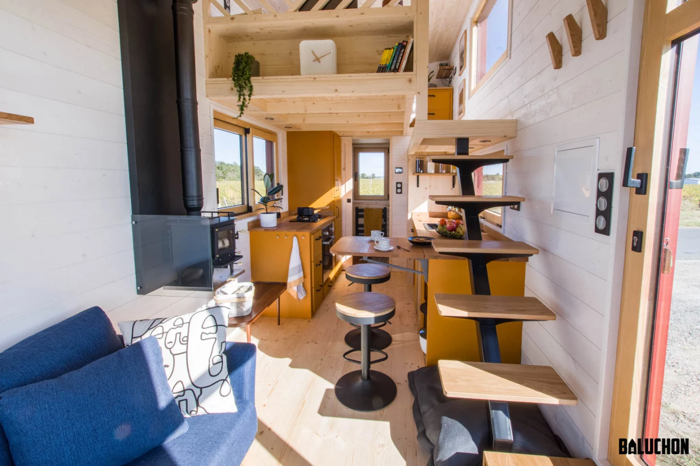 The Golden Hour's bedroom is reached by a floating staircase that's integrated into the kitchen cabinetry