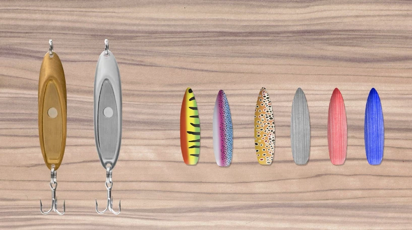 The main lure in pure and chrome-plated brass, with a set of the plates