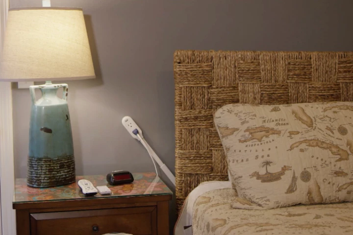 The Slide Socket, pictured here plugged into an outlet blocked by a bed