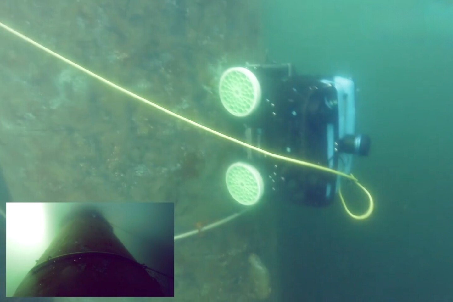The Crawfish gettin' busy underwater, with a view from its camera (inset)