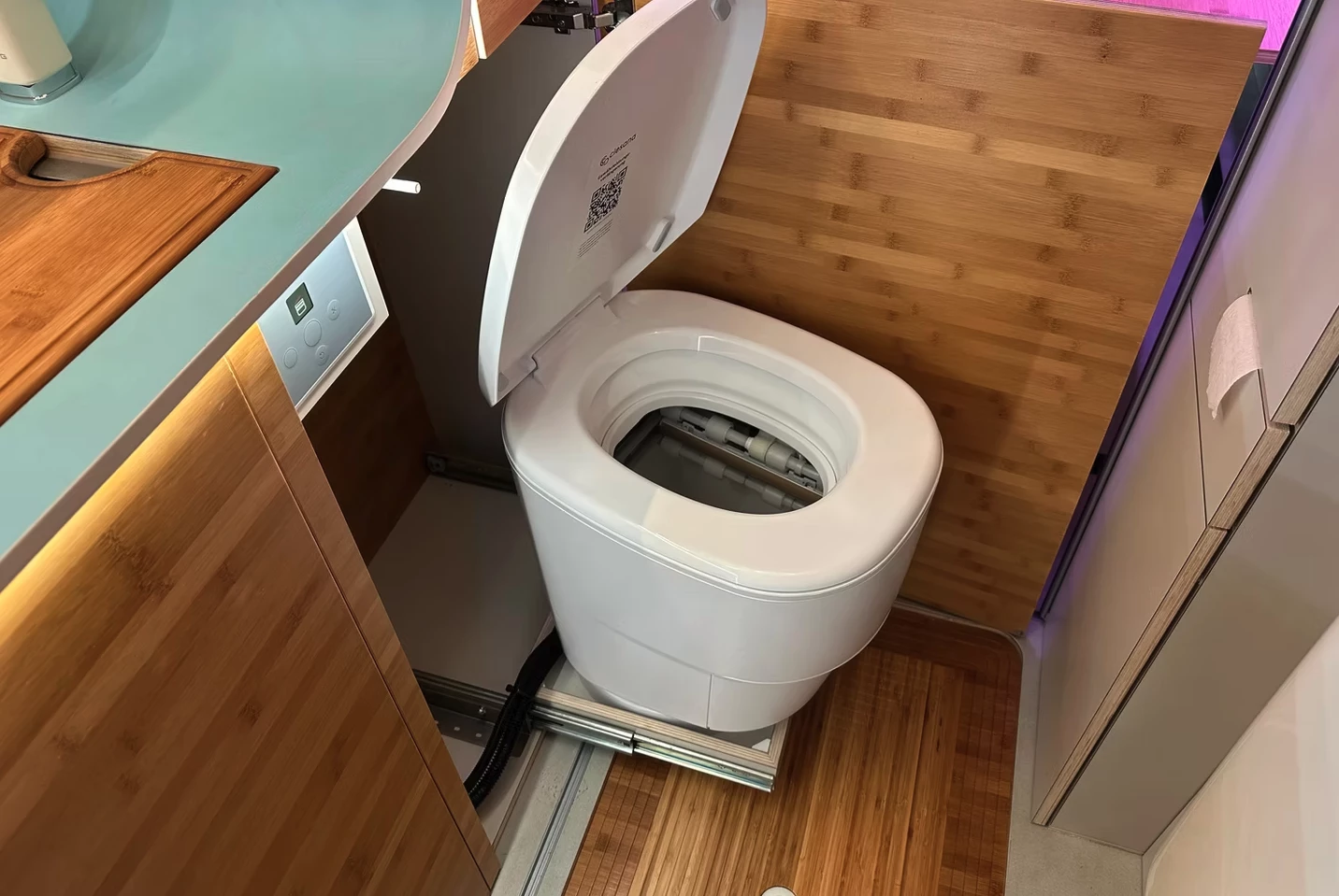 To accommodate the slide-out toilet, the roller door can split in two around it to create a privacy