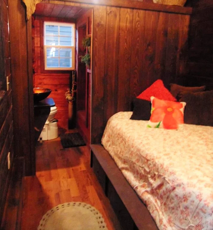 Another shot of the bedroom, with bathroom visible in background