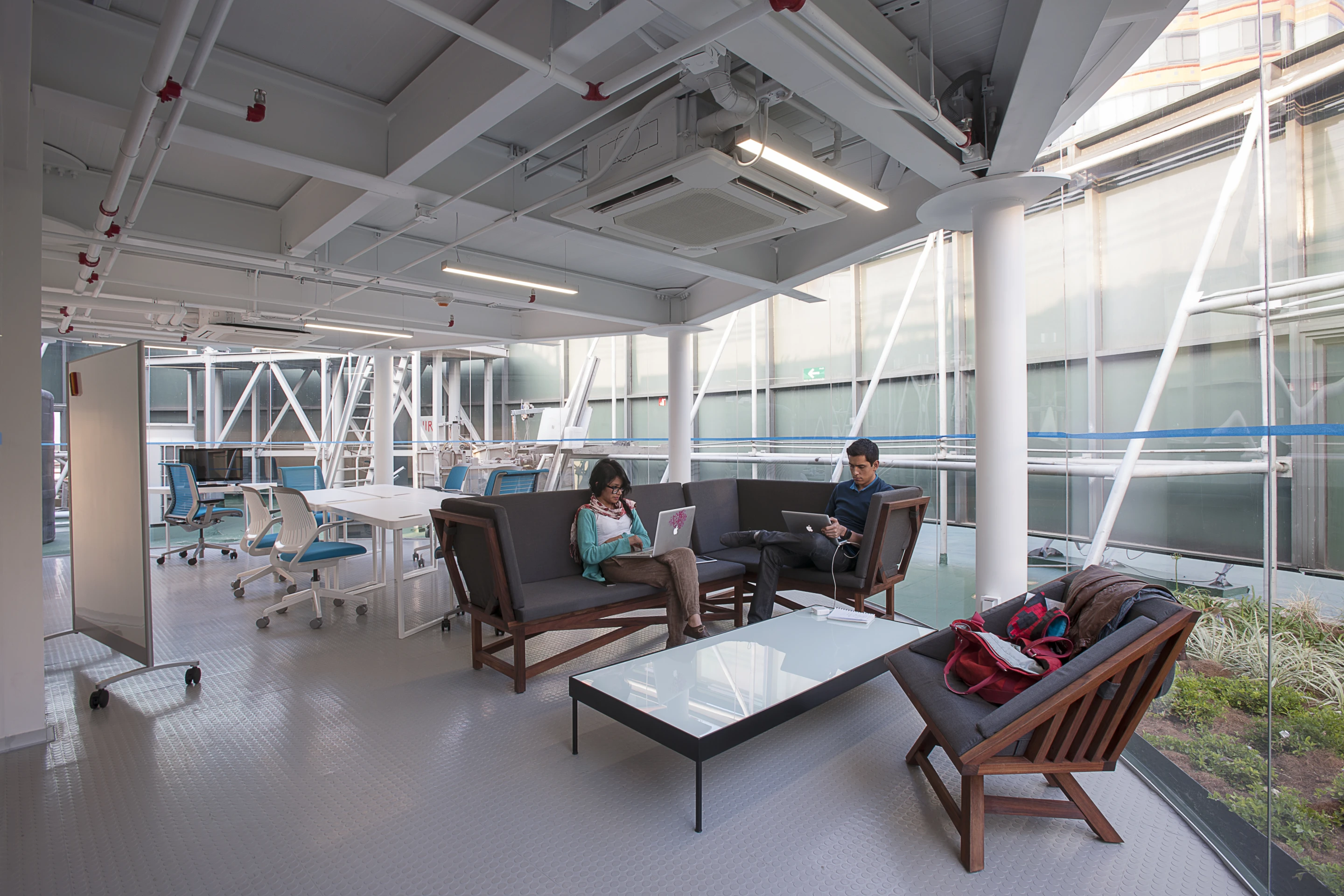 A series of solar panels are spread throughout the rooftop to generate a reported 3,840 kW of electricity per year, enough to meet the office's energy requirements (Credit: Jaime Navarro; Courtesy Rojkind Arquitectos)