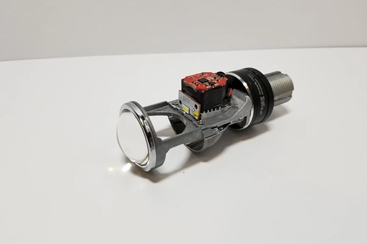 This tiny aftermarket headlight globe replacement turns your motorcycle headlight into a self-leveling projector beam