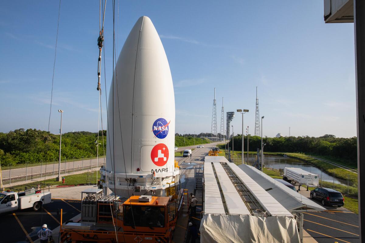 Nose cone containing Perseverance on its conveyor