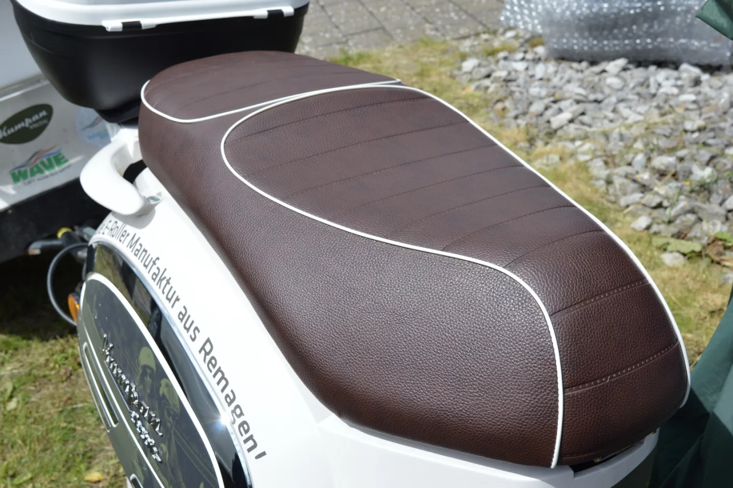 The twin saddle can accomodate two passengers for far longer than the scooter's range suggests