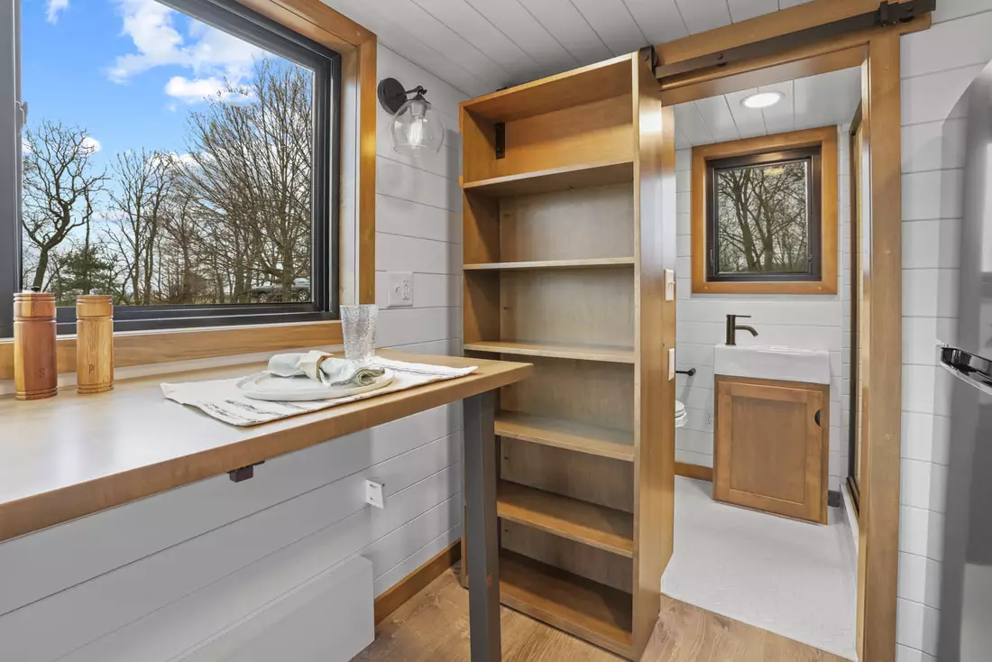 The Coastal Modern's bathroom is reached by a sliding bookcase, offering a little extra storage space over of a standard door