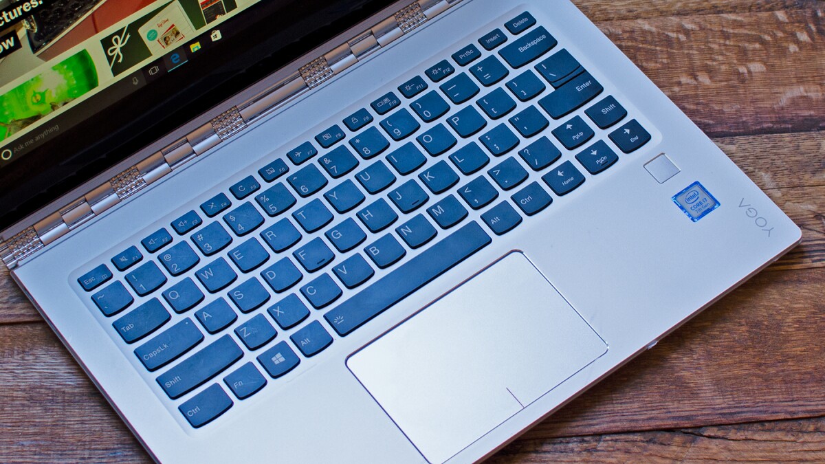 The Yoga 910's keyboard is big and easy to type on, but the right Shift and arrow keys are a little jumbled to make room for the fingerprint sensor