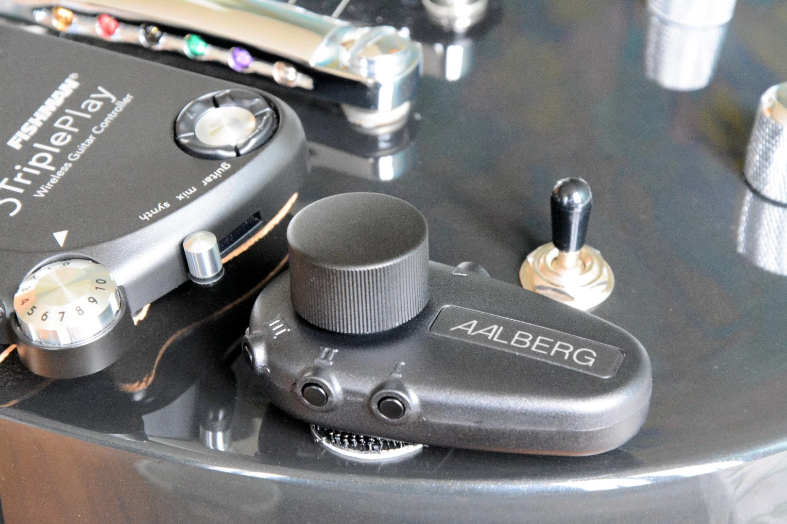 The Aero controller installed on a guitar with the help of industrial-strength Velcro