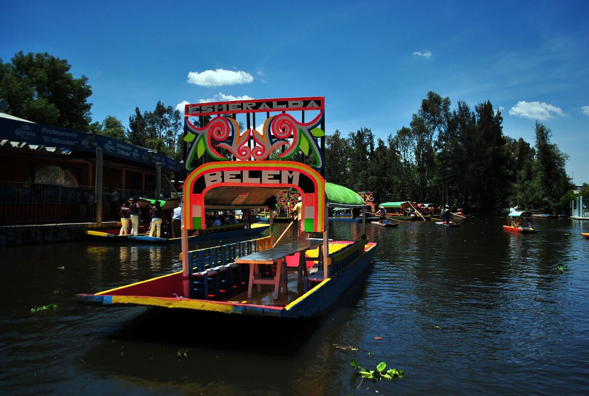Xochimilco tourist boats take visitors to see traditional chinampas