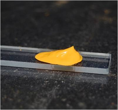 Titanium dioxide nanoparticles coated with cadmium sulfide produced a yellow paste that, when painted onto a transparent conductive material, generates electricity (Photo: ACS Nano)