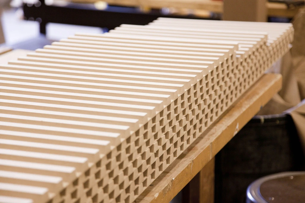 The Kuka robot arm has been busy churning out a number of interlocking panels